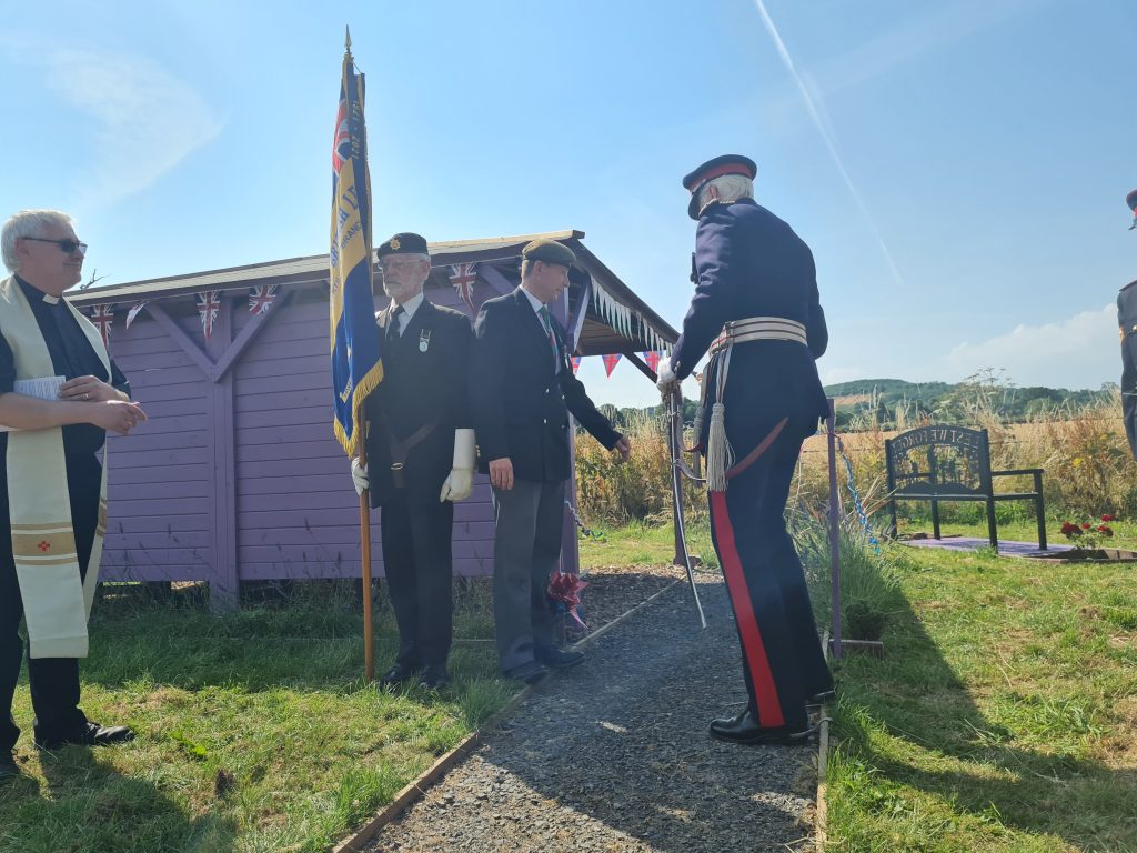 The ribbon is cut by Brigadier Robert Aitken, the Lord Lieutenant of Gwent, officially opening the Therapy Garden