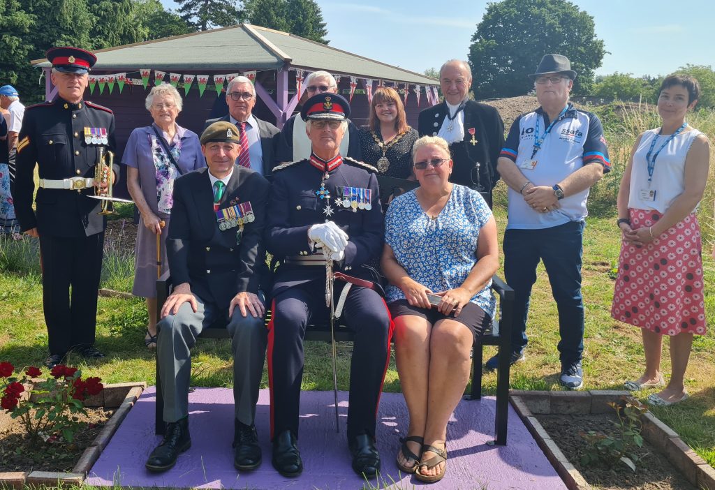 Dignitaries, including the Project Lead Damon Rees from Aneurin Bevan Veteran Service (front left), the Lord Lieutenant of Gwent Brigadier Robert Aitken (middle, front), and Monmouthshire County Council's Armed Forces Champion, Cllr Peter Strong and Chair, Laura Wright, were amongst those gathered at Maindiff Court Hospital's new Veterans Therapy Garden