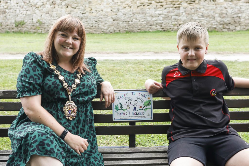 Cllr Laura Wright, Chair of Monmouthshire County Council, with Rohan, 13, who designed the plaque.