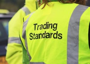 Photo showing back of a hi-vis jacket with the words Trading Standards