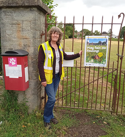 Sue installing signs at Belgrave Park in Abergavenny