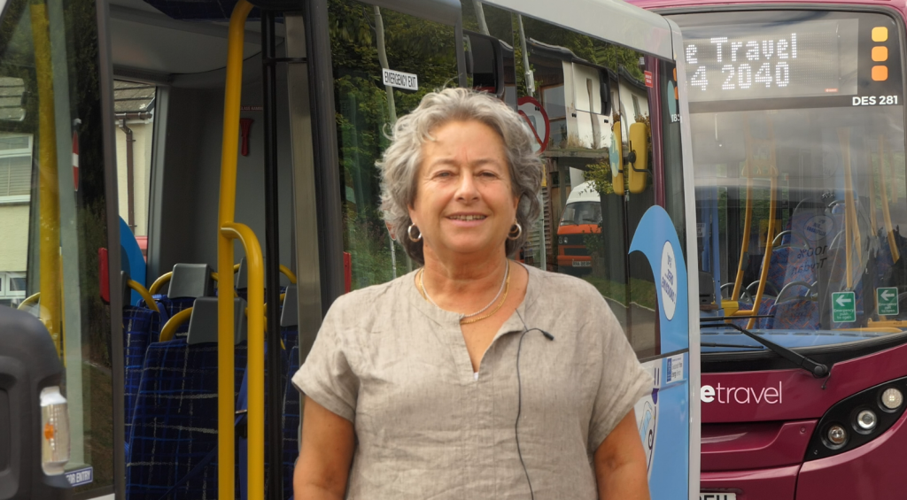 Cllr Catrin Maby with local buses