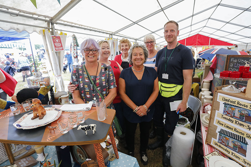 Cllr. Catrin Maby, Cabinet Member for Climate Change and the Environment (centre) with some of the colleagues that run the Reuse Shops at Llanfoist and Five Lanes recycling centres.