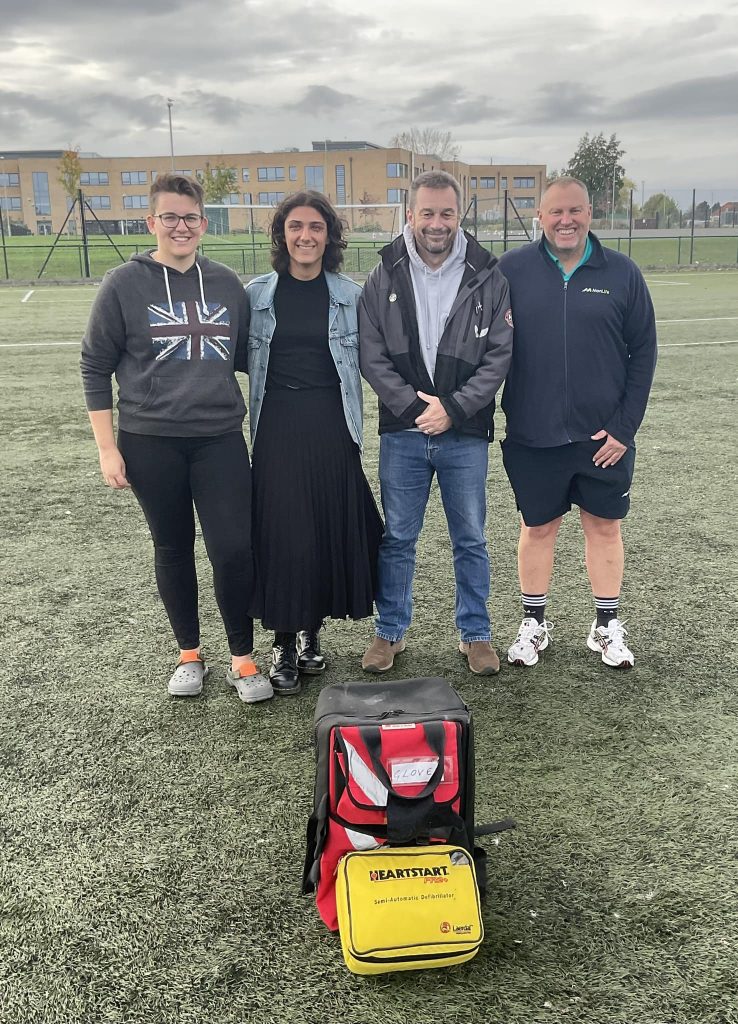 Alan Owen with colleagues whose quick actions saved his safe in April 2022