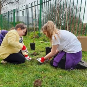 children planting trees