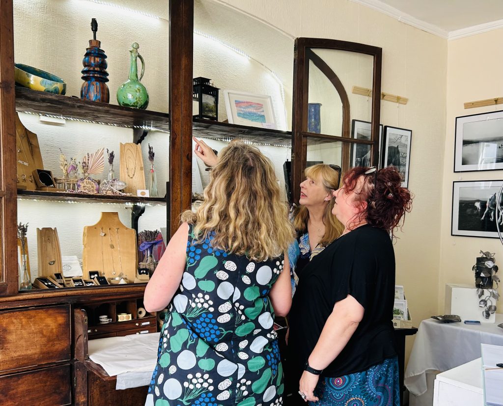 Ann Sumner and Beth McIntyre meeting with Emma Bevan-Henderson, Chair of the Abergavenny Art Festival meeting at the Makers Crafts Gallery in Abergavenny 