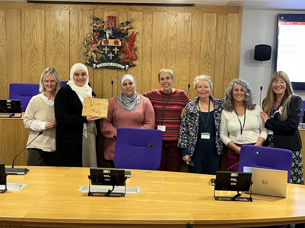 Members of Abergavenny Town of Sanctuary Group with Cabinet Member for Equalities and Engagement, Cllr Angela Sandles