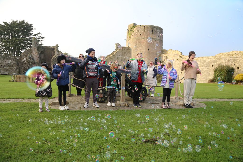 Young people and families gathered outside and blew wishes to their loved ones.